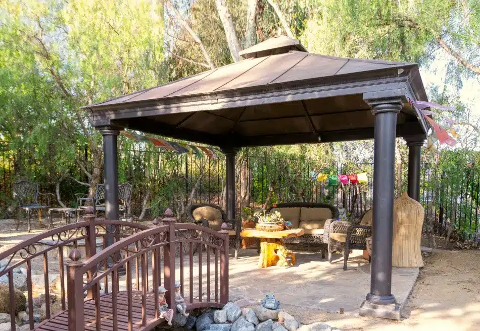 Villa Oasis backyard gazebo with a relaxing sitting area and a table