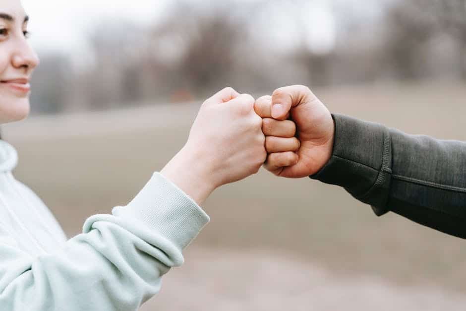 girl and guy fist bumping outside ( cocaine treatment program California)