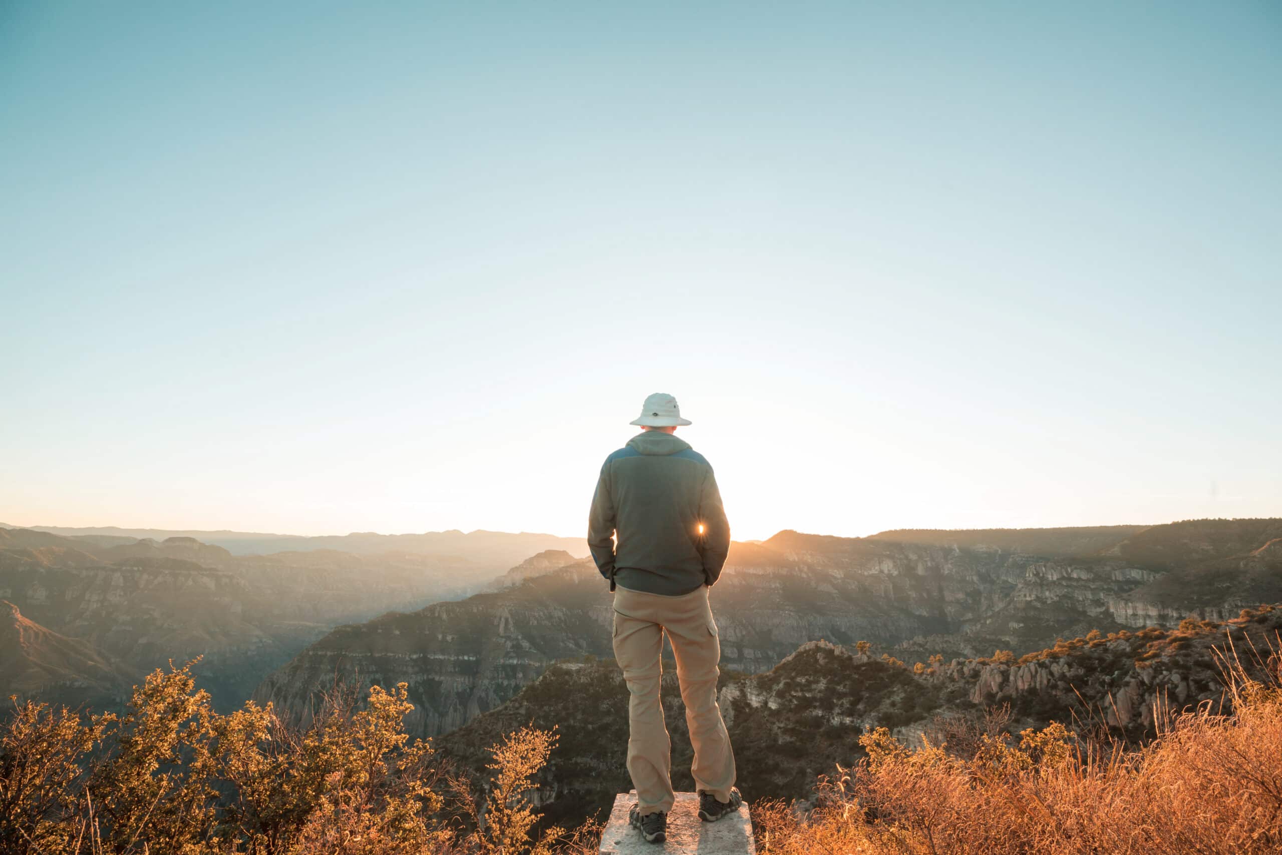 Hiking scene in beautiful summer mountains at sunset