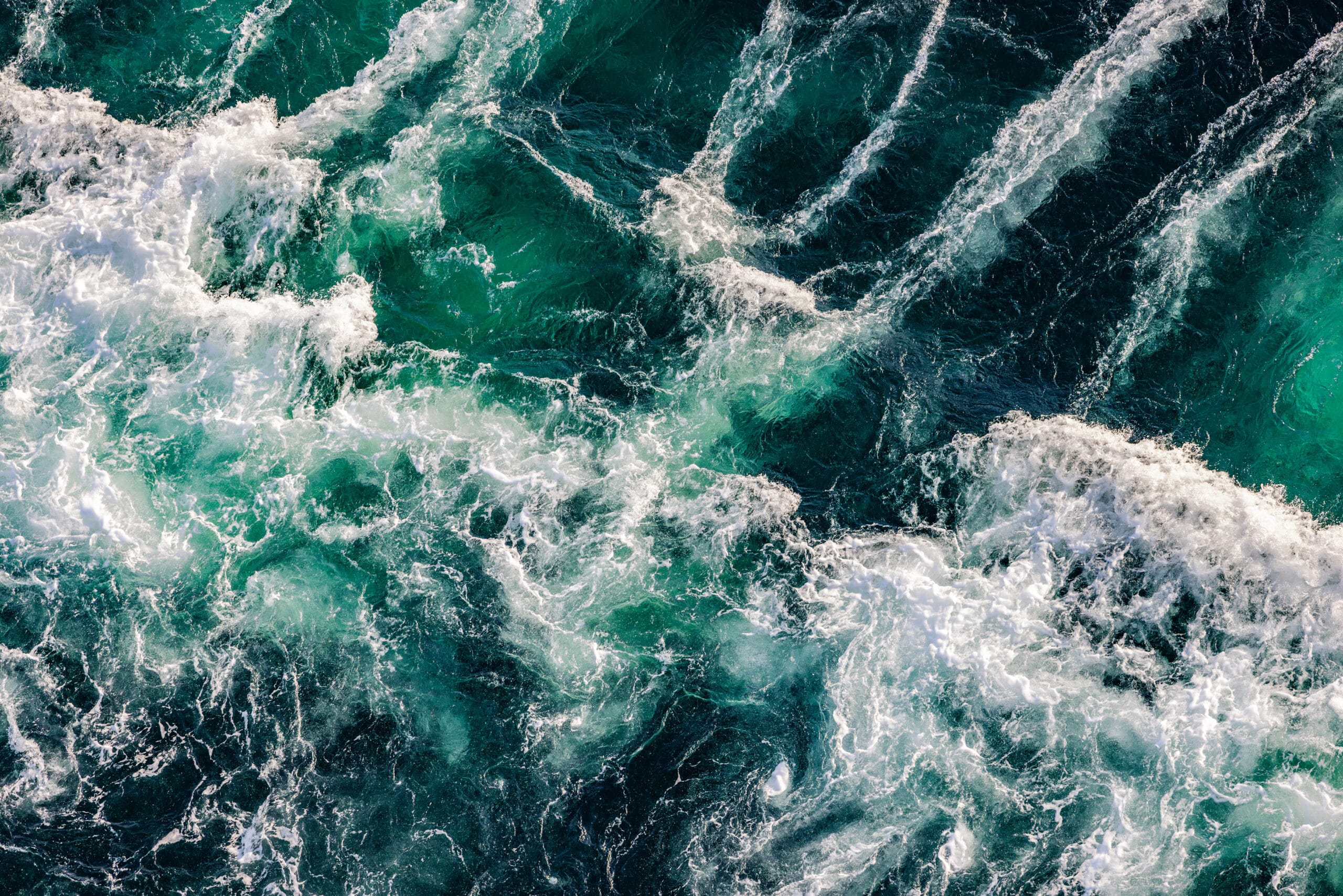 Blue waves of water of the river and the sea meet each other during high tide and low tide. Whirlpools of the maelstrom of Saltstraumen, Nordland , Norway.