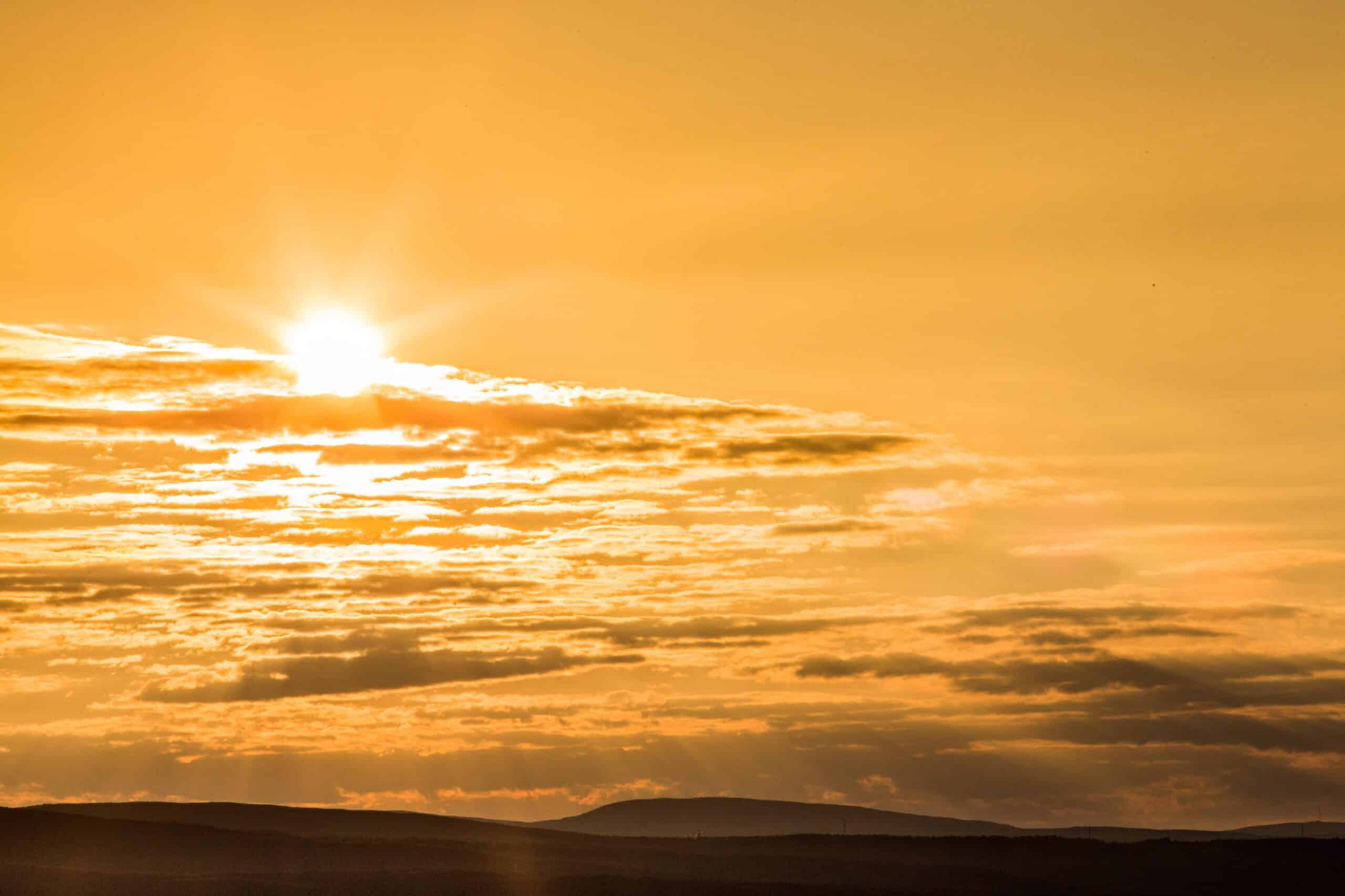 Sunset with clouds in sky and horizon