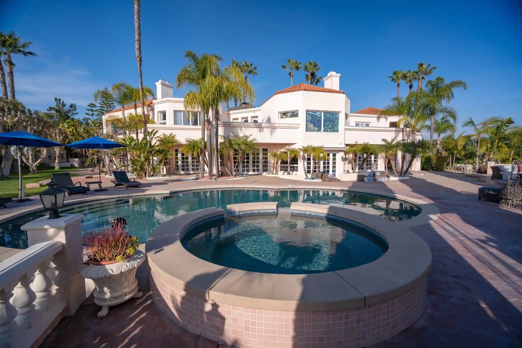 The Villa Oasis estate in Rancho Santa Fe with its pool, spa and palm-lined grounds