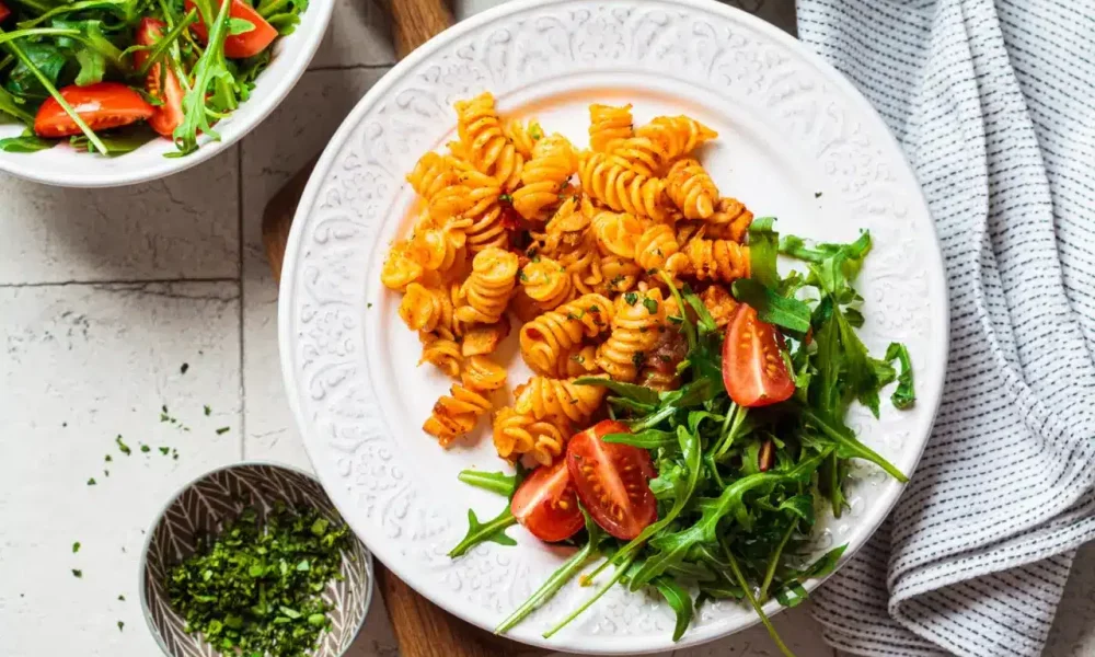 Tomato pasta with salad and tomatoes